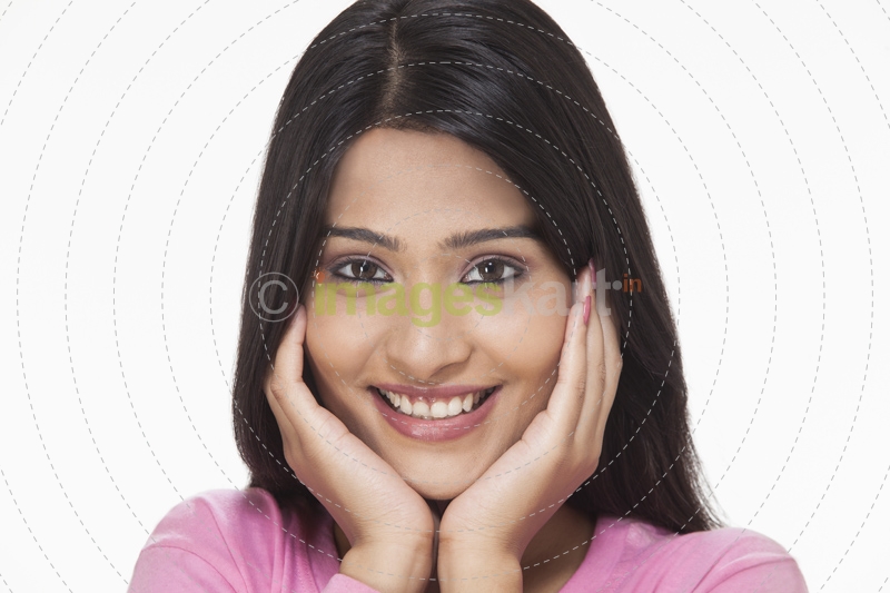 woman posing with hands on her face in awe