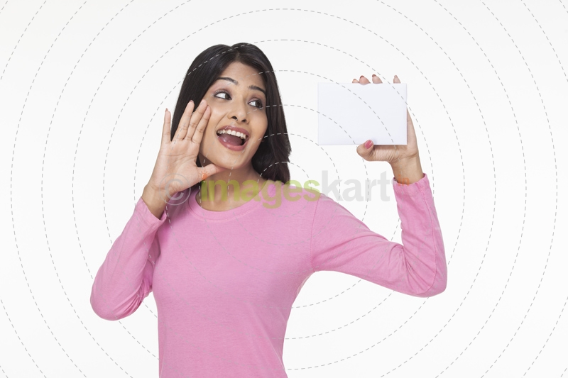 woman posing with a card