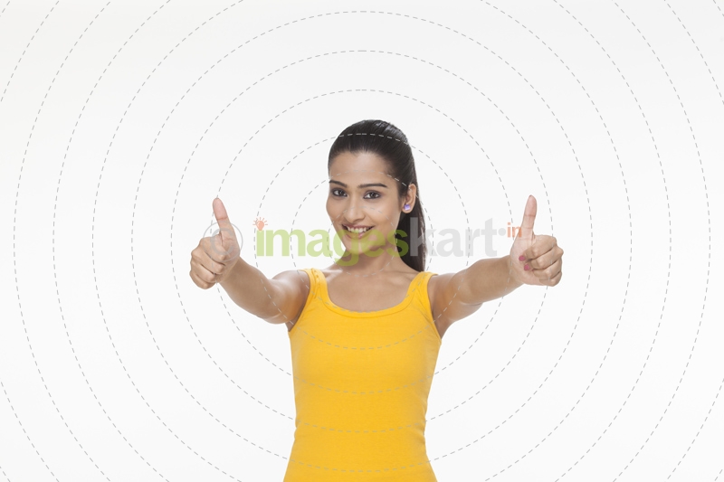 girl showing thumbs up