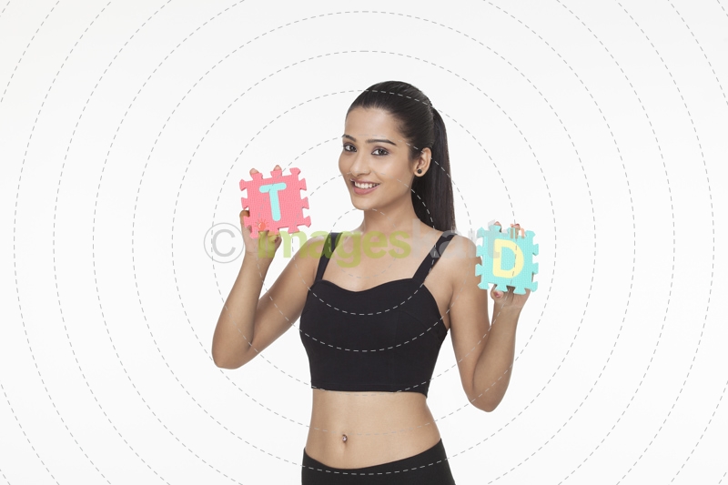 girl posing with letter T and D