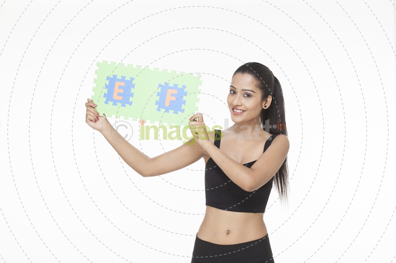 girl posing with jigsaw puzzle 