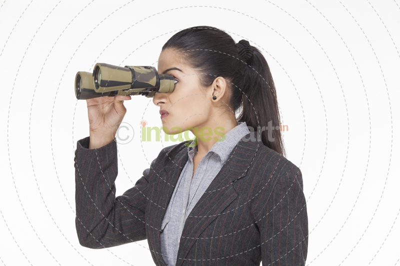woman looked angry while looking at something through binocular 