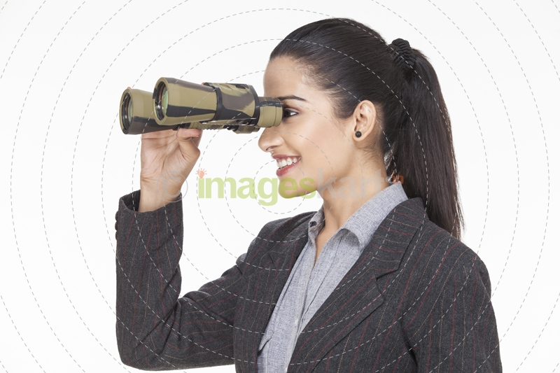 corporate woman looking through binocular