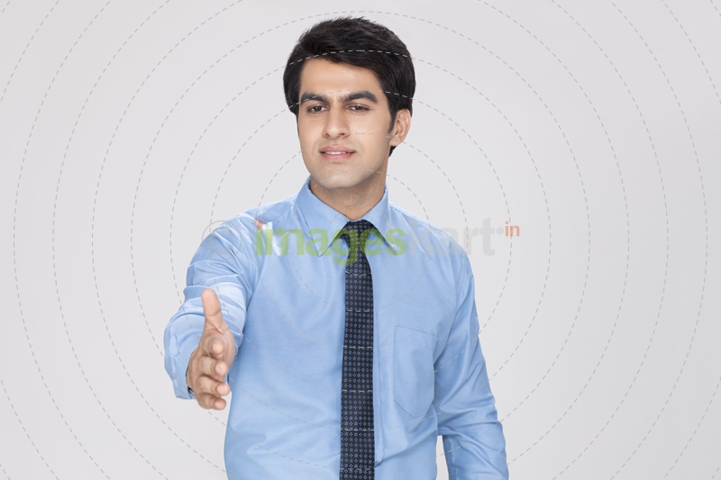 man putting forward his hand for handshake 