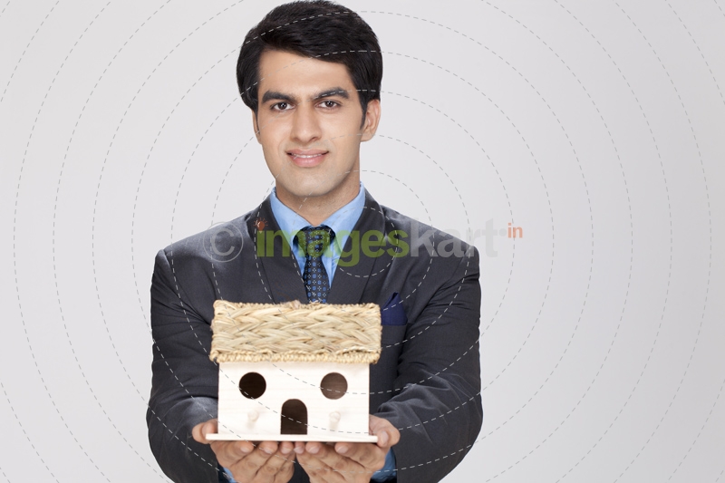 man posing with home miniature
