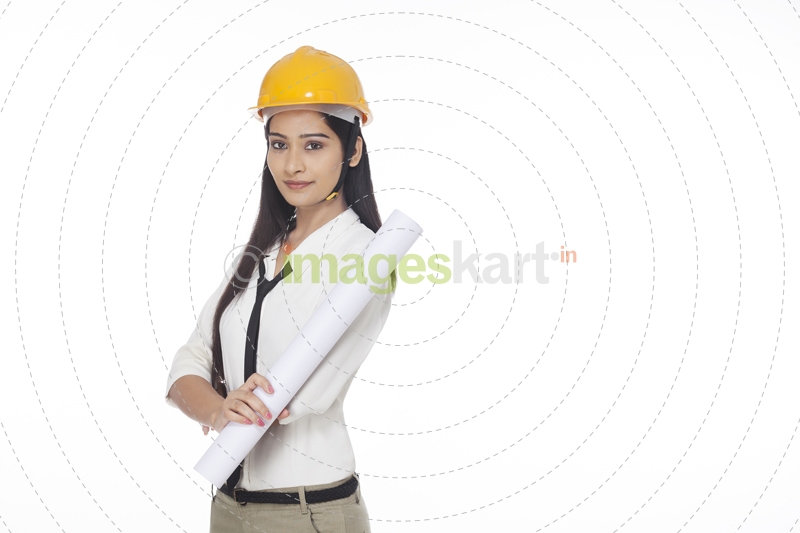 girl wearing hardhat and holding chart paper