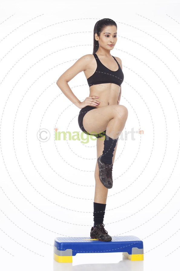 girl exercising with stepper
