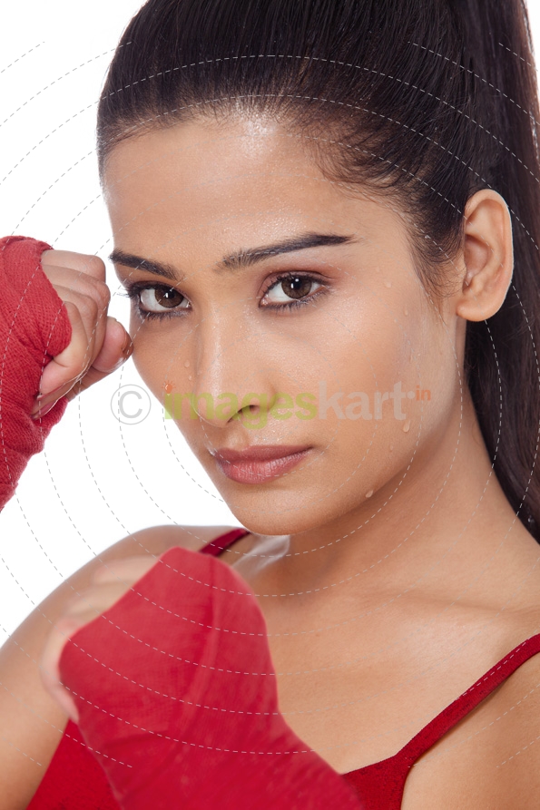 close up of girl wearing boxing gloves 