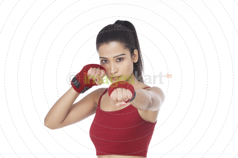 girl punching while looking at the camera