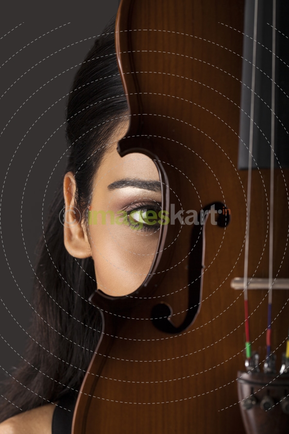 close-up on the eye of a girl with violin
