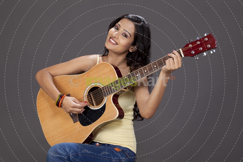 girl playing guitar and posing 