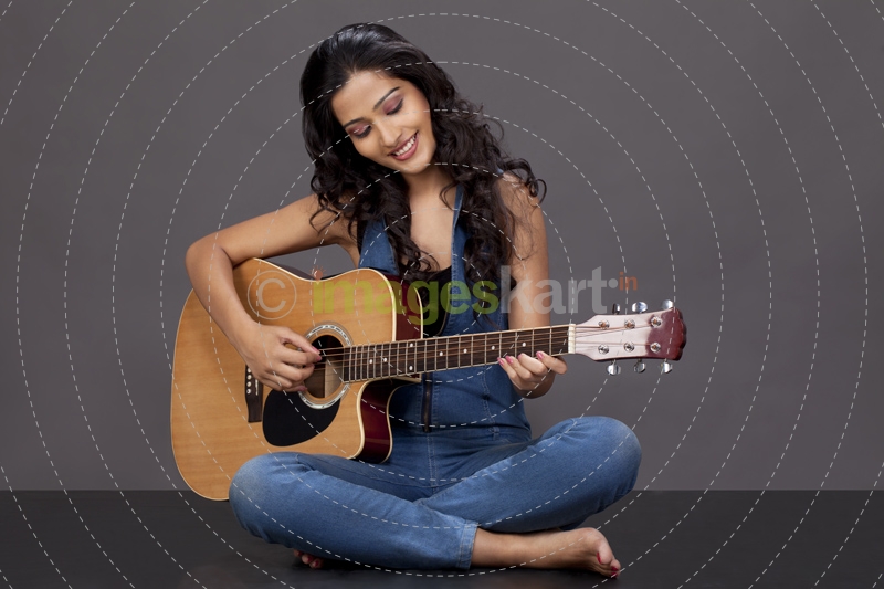 girl playing guitar   