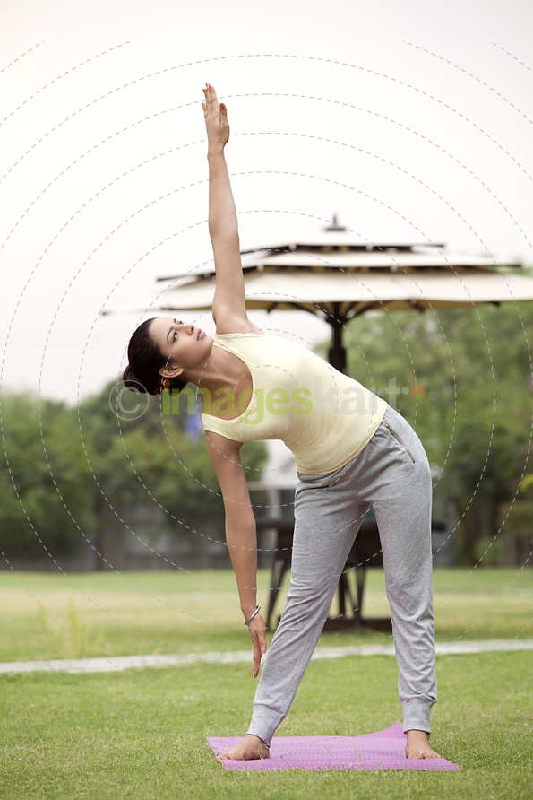 girl doing exercise in park