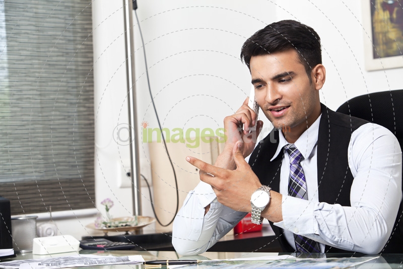 man at his office desk