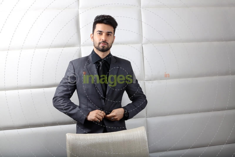 man posing in formals at work