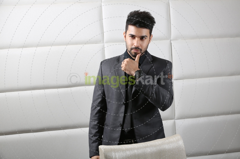 man in professional wear posing at work