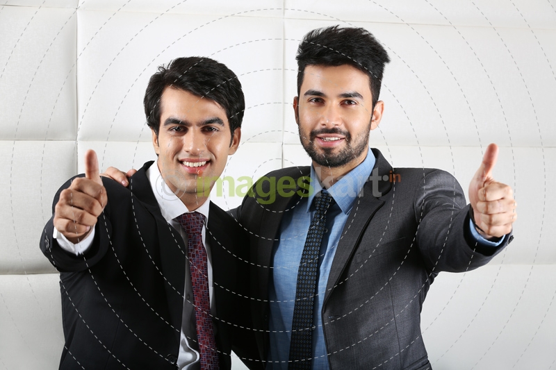 two men doing thumbs up