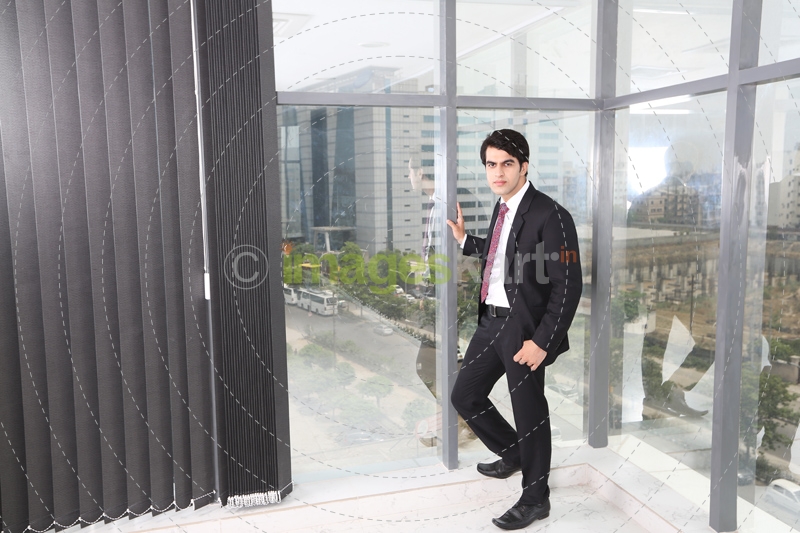man in formals standing outside office