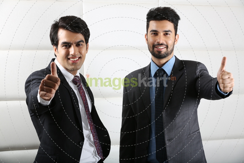 man posing happily and doing thumbs up