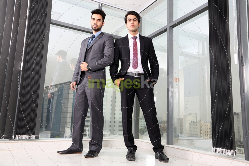 men in formal attire standing 