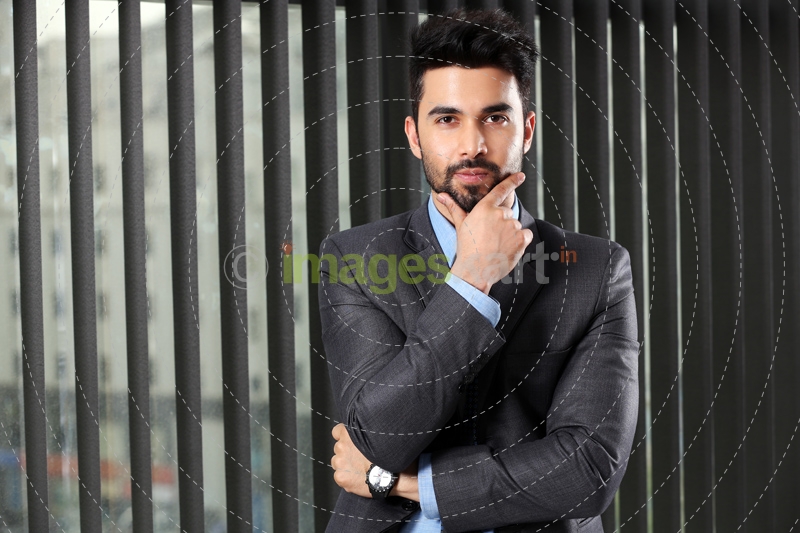 man posing wearing formal attire