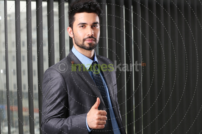 man in formals doing thumbs up