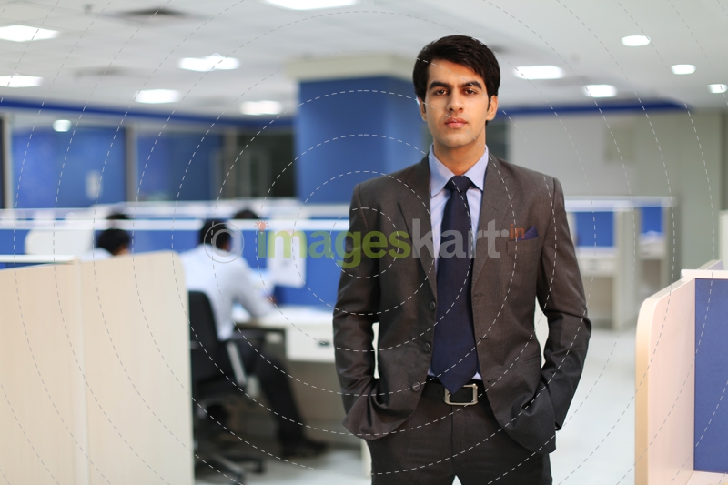 Man in formal clothing with hands in pockets