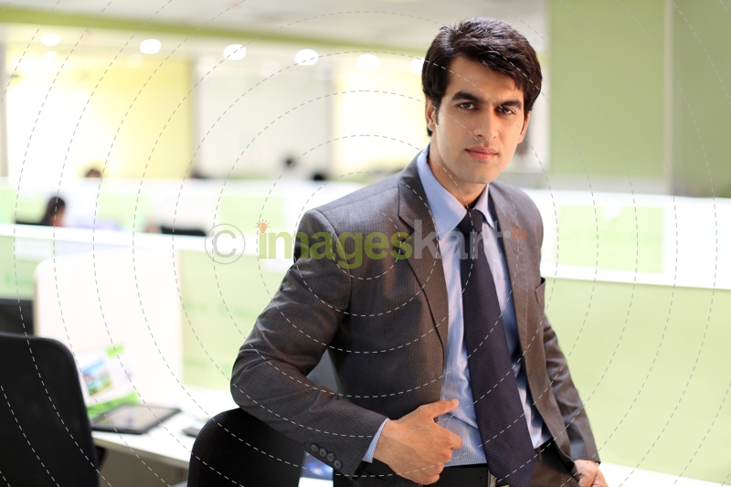 man in formal wear posing   