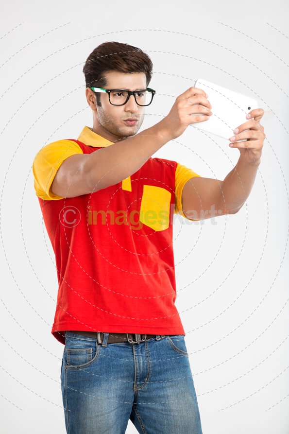 college boy playing game on tablet 