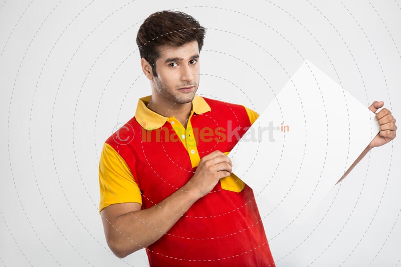 man holding white board