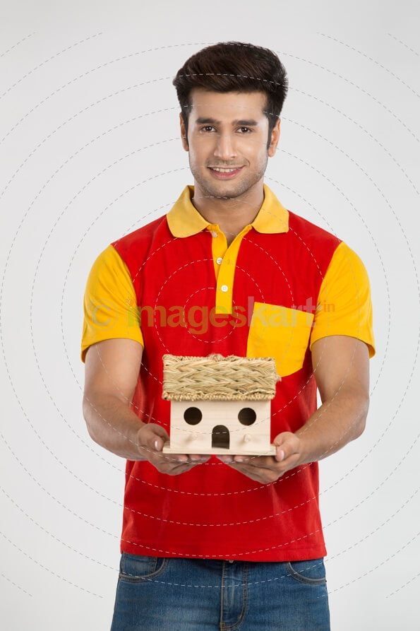 man posing with home miniature