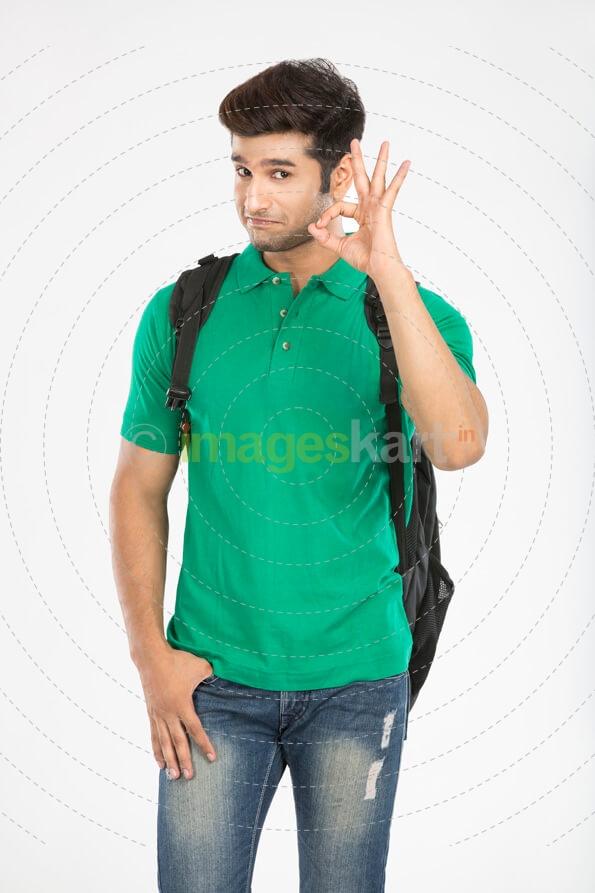 young college boy posing while gesturing for the camera 
