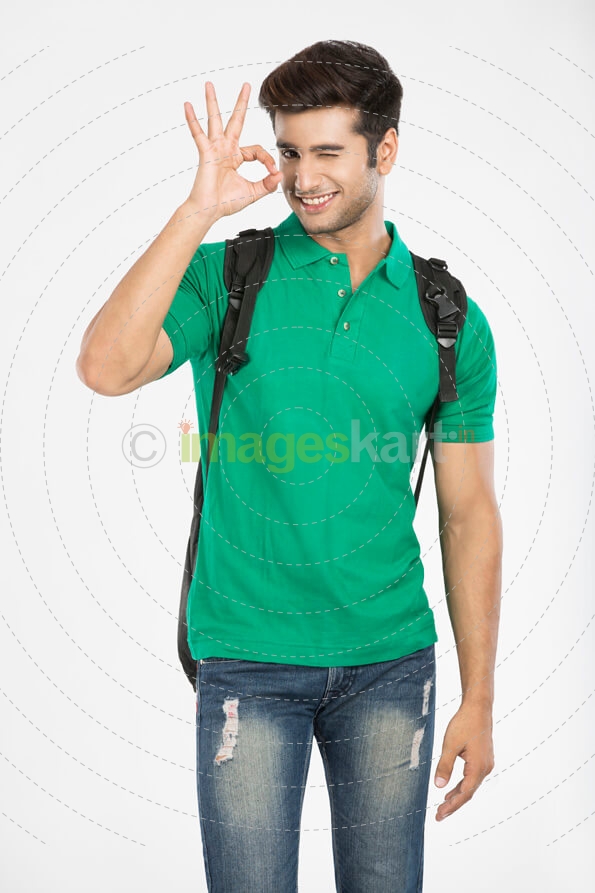 college boy gesturing while posing for the camera 