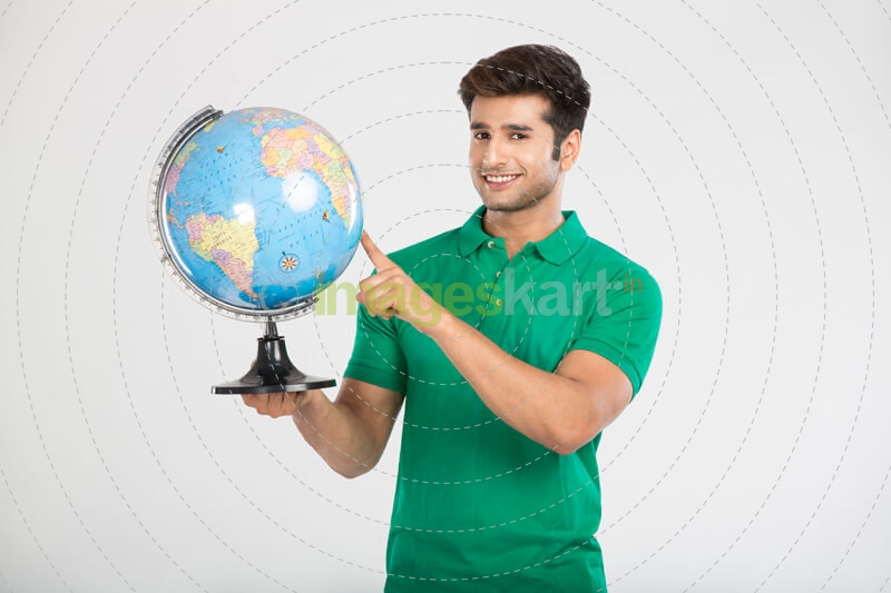 man pointing at the globe
