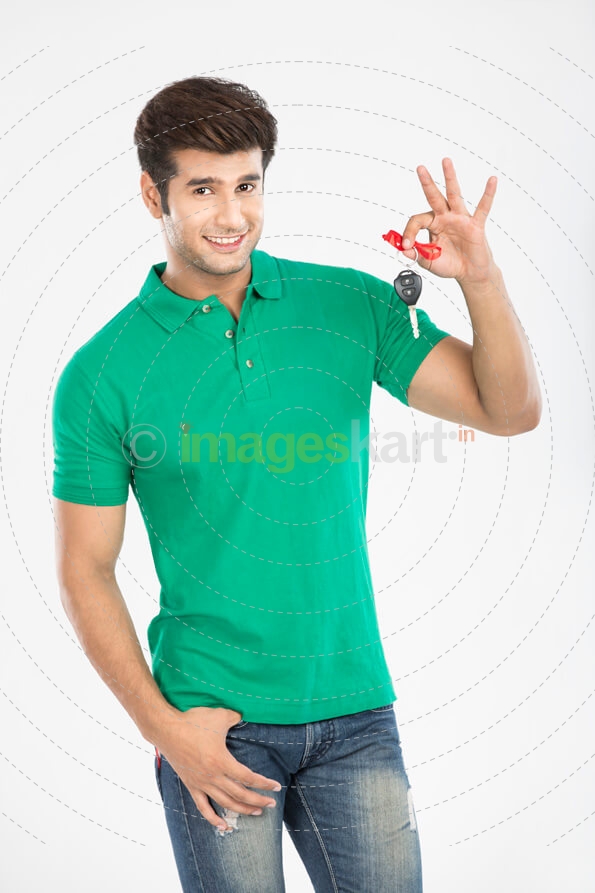 man showing car key and smiling 