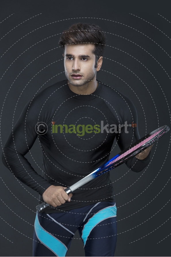 man with tennis racket in action while playing tennis