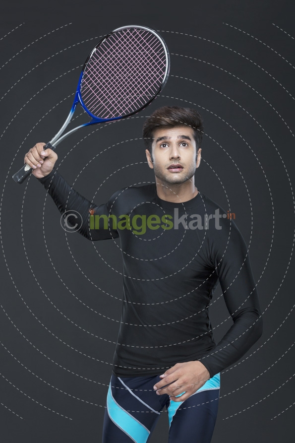 man in action while playing tennis