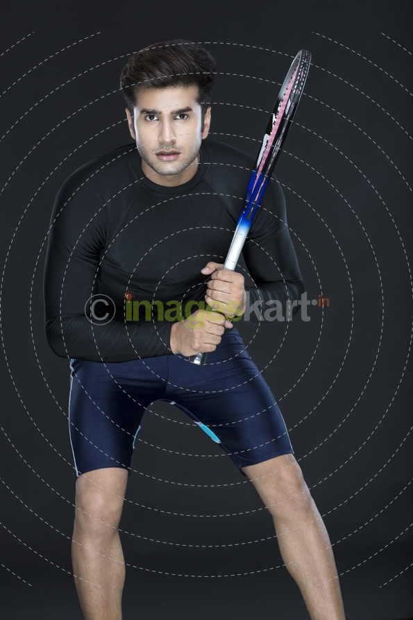 man in sports wear playing tennis 