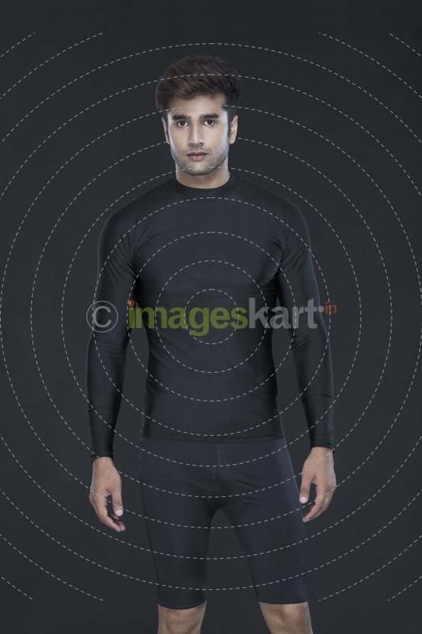 man in sportswear posing while looking at the camera 