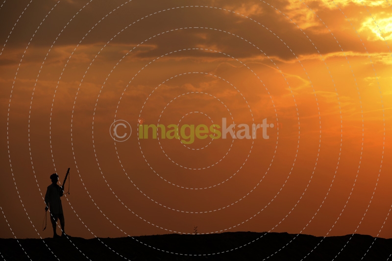 silhouette of a man standing against sun 