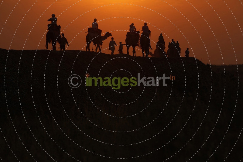 tourists taking camel ride