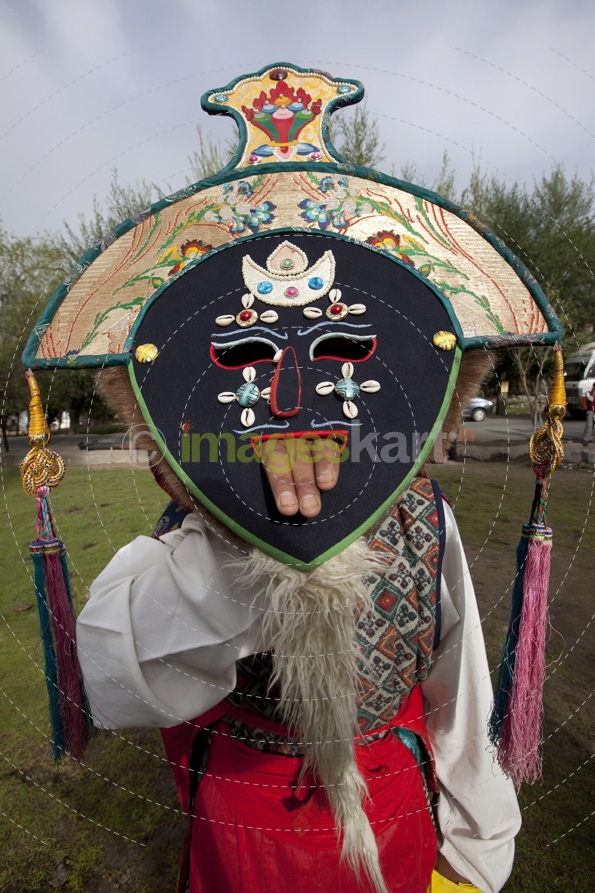 people with traditional masks at the ladakh festival
