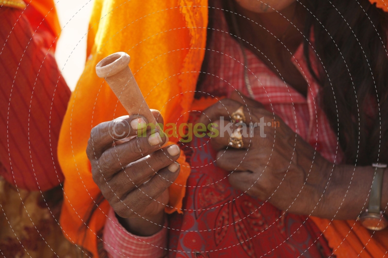 close-up of a woman smoking chillum