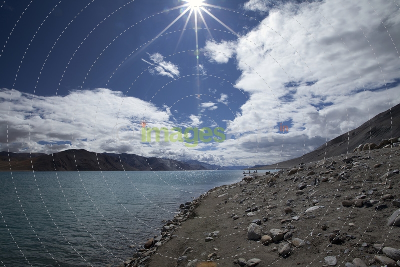 beautiful bright day with sunlight along mountains and river 