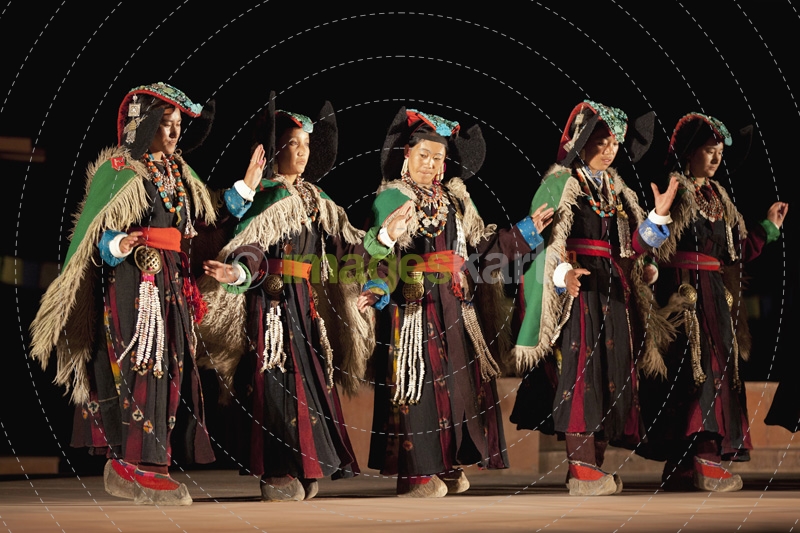 women performing folk dance at the local festival in ladakh