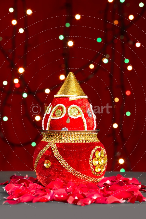 decorated kalash with lighting in background