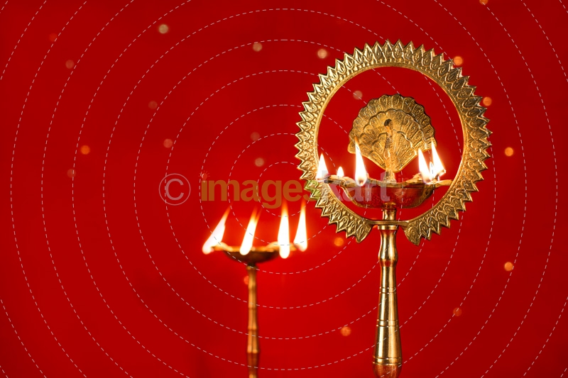 diya stands against red background