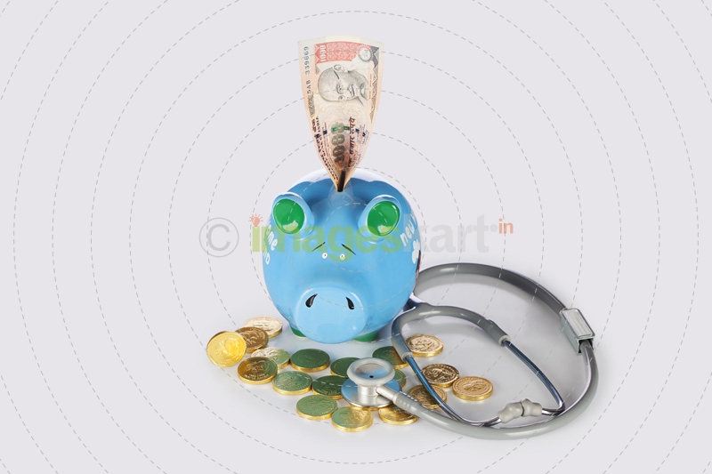 piggy bank with gold coins,note and stethosocope