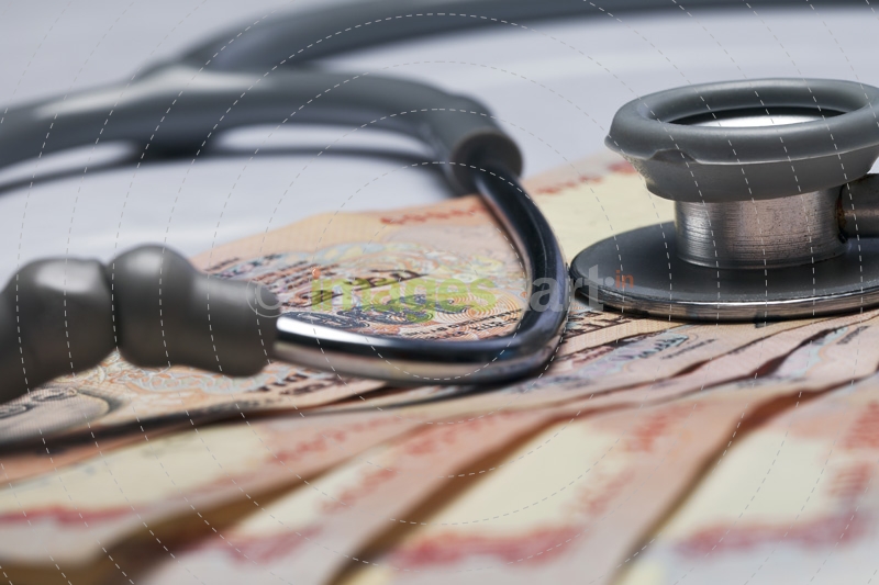 stethoscope and cash