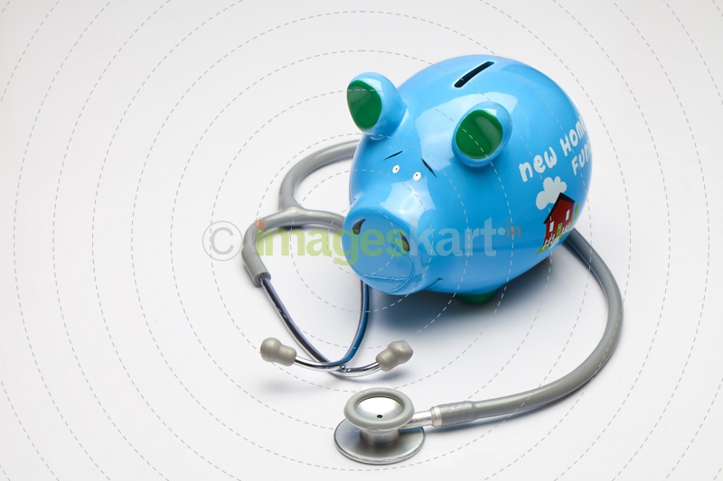 piggy bank with stethoscope  